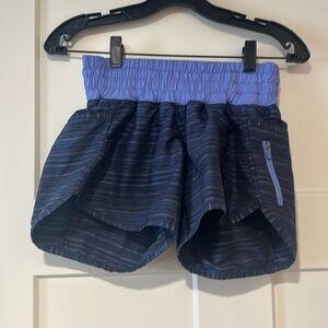 Lululemon women shorts; worn once; purple, black; blue; grey. Size 6.